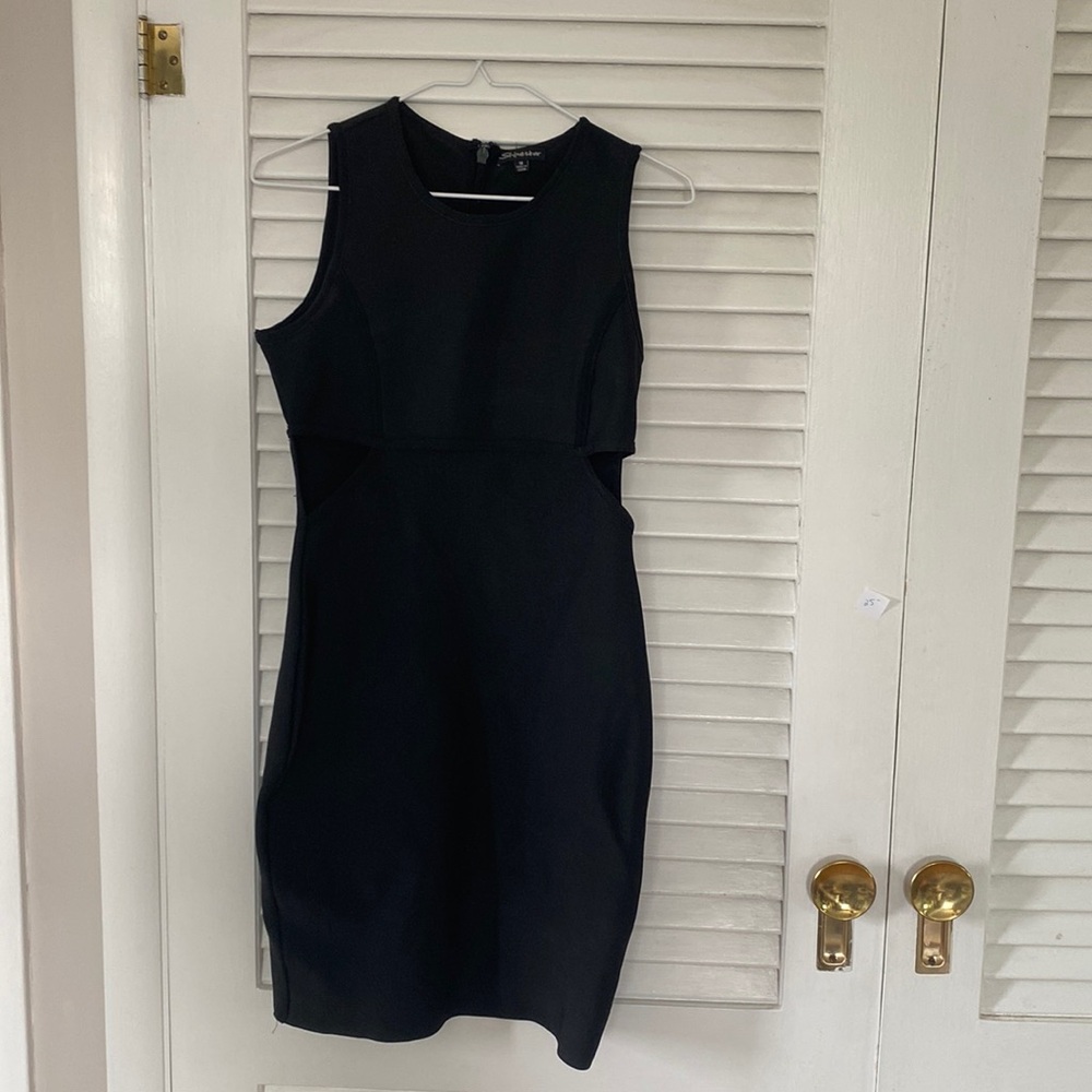 Black tight dress with cut outs on sides.